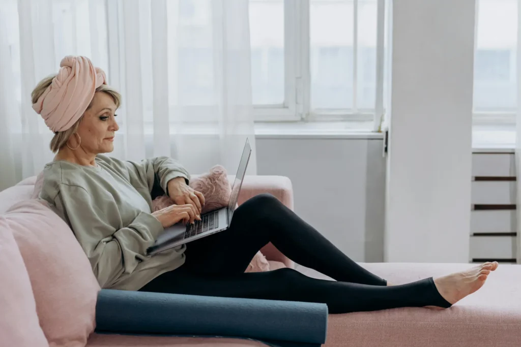 A senior woman relaxing on the sofa in a New Milton home