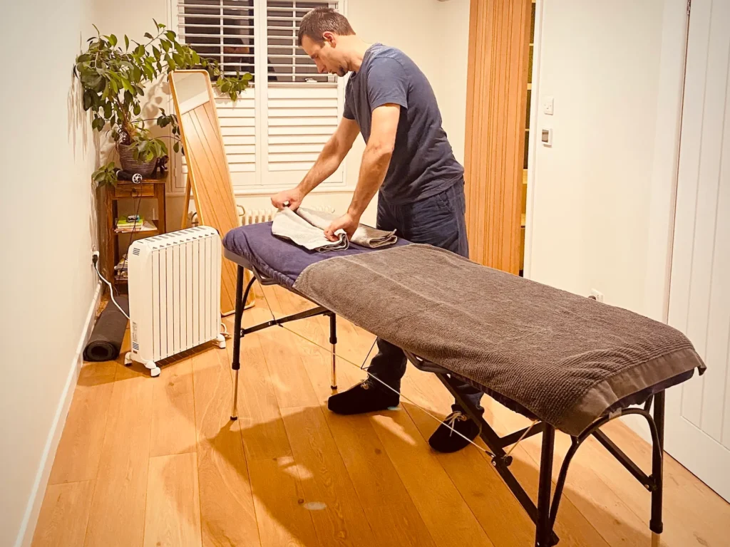 Massage table is being set up ready for a home session in Dorset